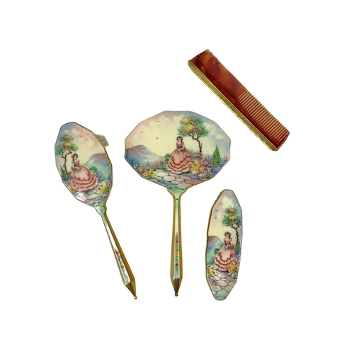 70 - 1930’s enamel vanity set with a hand painted Victorian scene. In original case. Case measures 28 x 2... 