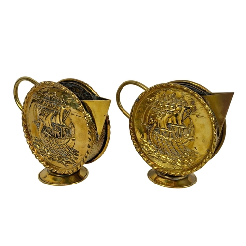 71 - Pair of vintage brass round handled pitchers with Viking longboat theme. Larger of the pair 22 x 18c... 