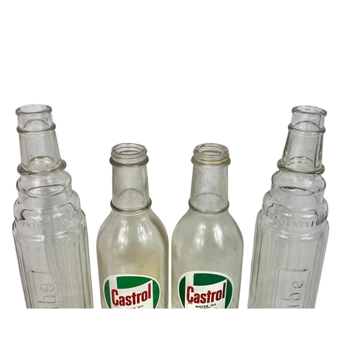 92 - 4 glass motor oil bottles. Castrol and Esso. Largest 38cm