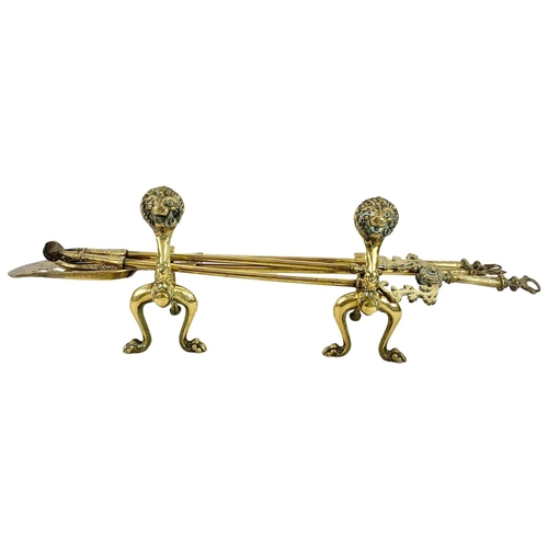 108 - Victorian brass firedogs. Tools measure 81cm