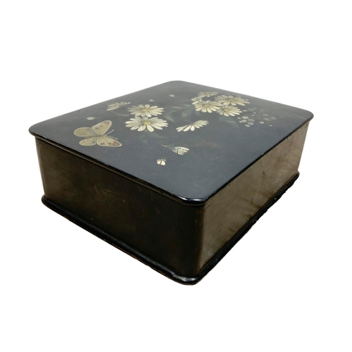 115 - Early 20th century lacquered box with hand painted flower and butterfly decoration. 18 x 15 x 6cm