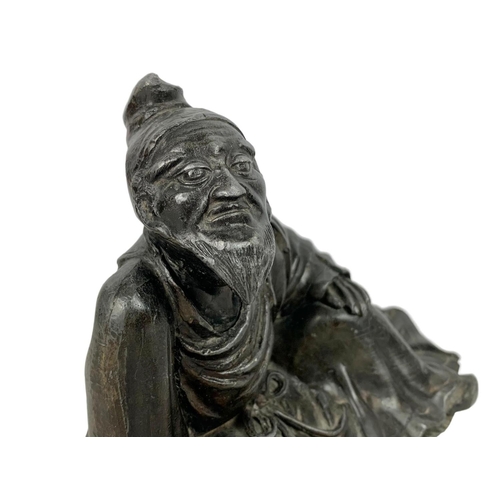 54 - 19th century Chinese pewter figure. 20 x 13cm