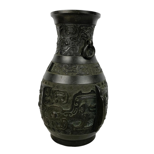 55 - 19th century Chinese bronze alter vase in the Archaistic style with loop handles. 31cm