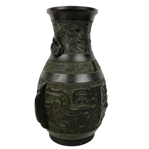 55 - 19th century Chinese bronze alter vase in the Archaistic style with loop handles. 31cm