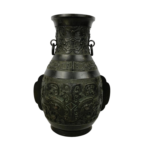 55 - 19th century Chinese bronze alter vase in the Archaistic style with loop handles. 31cm