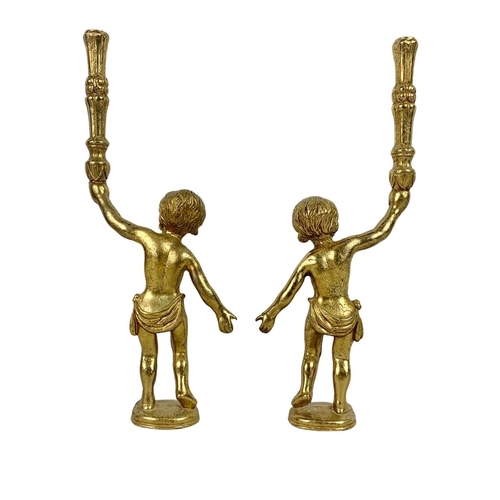 144 - A set of 4 early 20th century heavy brass cherub figures. Circa 1900/1910. 33cm