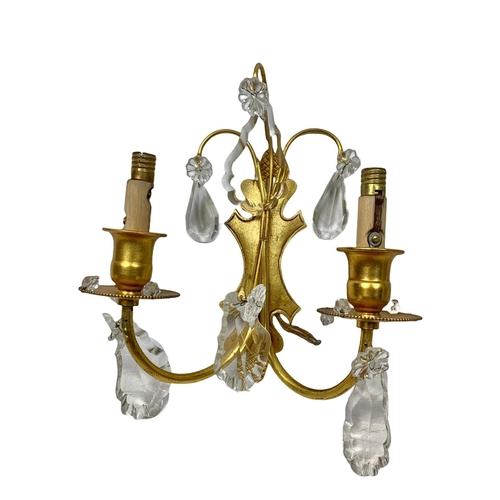 194 - 3 early 20th century gilded brass wall sconces. With glass droplets. Circa 1920/30. Largest 47cm