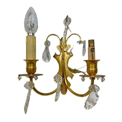 194 - 3 early 20th century gilded brass wall sconces. With glass droplets. Circa 1920/30. Largest 47cm