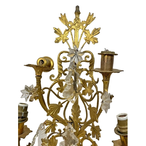 194 - 3 early 20th century gilded brass wall sconces. With glass droplets. Circa 1920/30. Largest 47cm