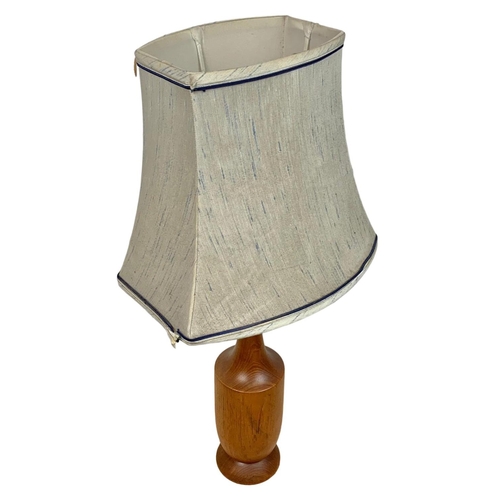 195 - Teak table lamp. Circa 1970’s. 64cm including shade.