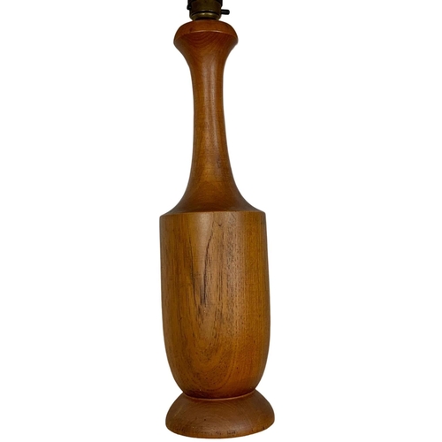 195 - Teak table lamp. Circa 1970’s. 64cm including shade.