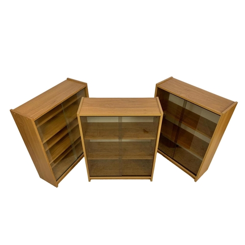 1179 - 3 mid century teak veneer bookcases. 60 x 23 x 80cm