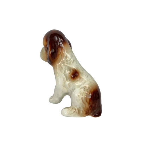 544 - 2 pottery dogs by Sylvac. Largest 17cm