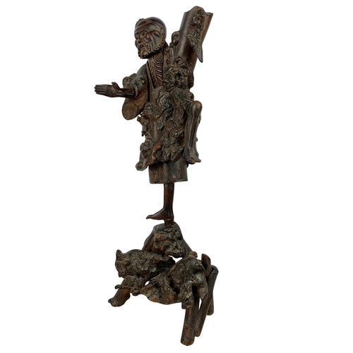 289 - 19th century Chinese carved root wood figure. 54cm