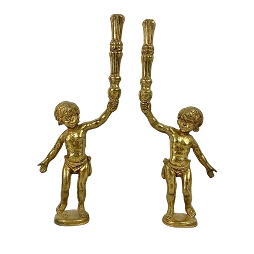 295 - A set of 4 early 20th century heavy brass cherub figures. Circa 1900/1910. 33cm