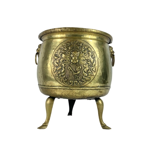 312 - Large Victorian brass coal bucket with hoof feet and ring side handles. Circa 1890. 38 x 38.5cm