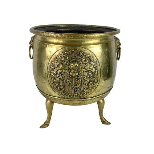 312 - Large Victorian brass coal bucket with hoof feet and ring side handles. Circa 1890. 38 x 38.5cm