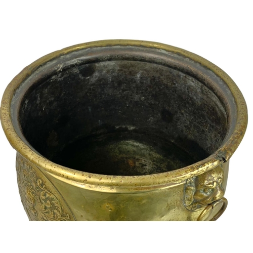 312 - Large Victorian brass coal bucket with hoof feet and ring side handles. Circa 1890. 38 x 38.5cm