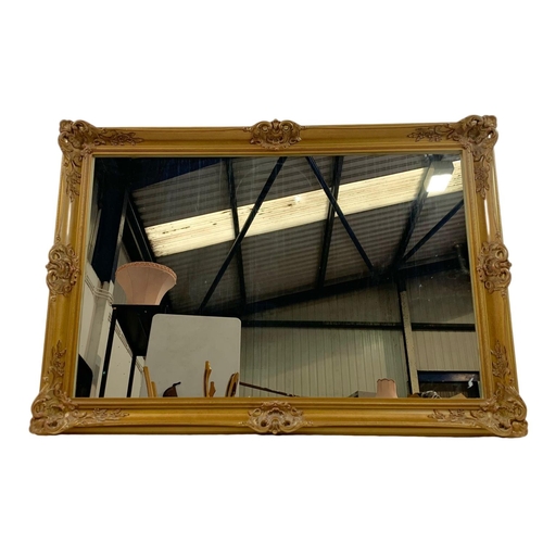 317 - Large ornate gilt framed mirror. 102 x 72cm