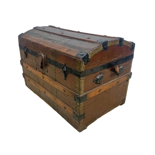 105 - An Edwardian dome top trunk. 67 x 43 x 47cm