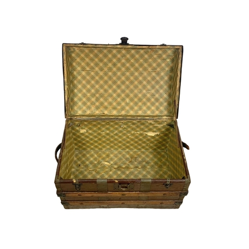 105 - An Edwardian dome top trunk. 67 x 43 x 47cm