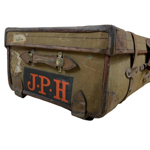 111 - Large vintage leather bound travelling trunk. 92 x 57 x 33cm