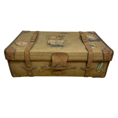 111 - Large vintage leather bound travelling trunk. 92 x 57 x 33cm