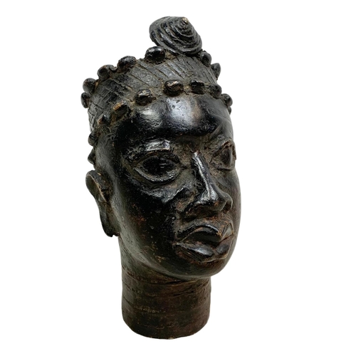 121 - An early 20th century Benin bronze bust. 17.5cm