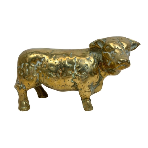 125 - Quantity of vintage brassware. Including a large heavy brass cow 24cm, a pair of brass flower patter... 