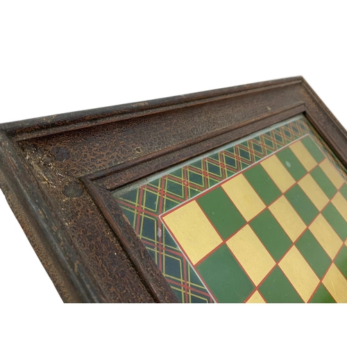 127 - A 19th century framed hand painted tile game board. Frame with original scumble paint. 45 x 45cm