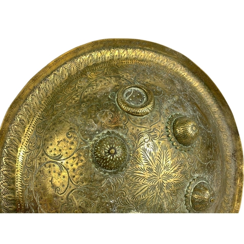 138 - A pair of early 20th century Far Eastern decorative brass shields. Circa 1910-1910. 32cm