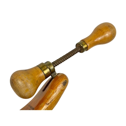 139 - A pair of early 20th century shoe stretchers by Greenwood’s. 23cm, Circa 1920