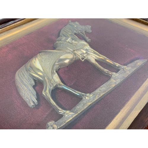 143 - A pair of Victorian shadow box framed brass horses. 46.5 x 36cm.