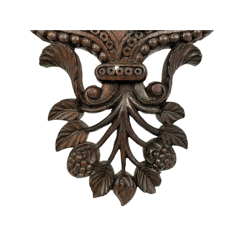 150 - A large late 19th century carved padauk wood wall bracket. Circa 1880. 34 x 57cm