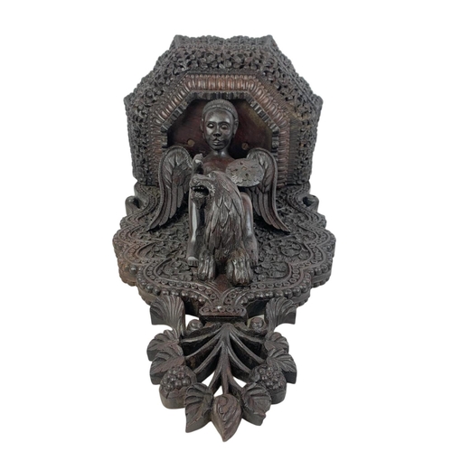 150 - A large late 19th century carved padauk wood wall bracket. Circa 1880. 34 x 57cm