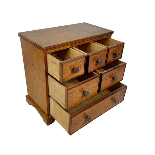 153 - An Edwardian oak 6 drawer miniature chest. 32 x 17.5 x 30cm