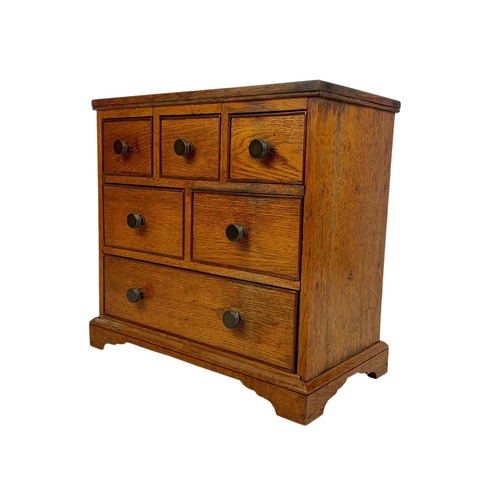 153 - An Edwardian oak 6 drawer miniature chest. 32 x 17.5 x 30cm