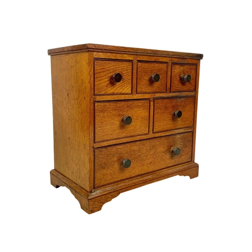 153 - An Edwardian oak 6 drawer miniature chest. 32 x 17.5 x 30cm