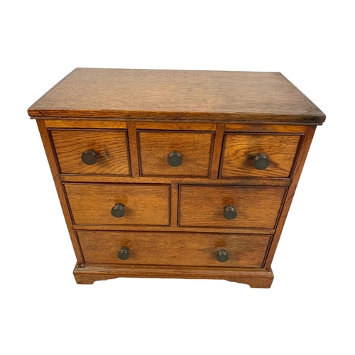 153 - An Edwardian oak 6 drawer miniature chest. 32 x 17.5 x 30cm