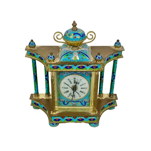 157 - 18th century style cloisonné mantle clock in box. Clock measures 21 x 23cm.