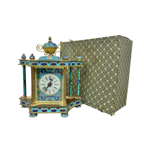 157 - 18th century style cloisonné mantle clock in box. Clock measures 21 x 23cm.