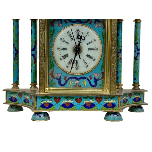 157 - 18th century style cloisonné mantle clock in box. Clock measures 21 x 23cm.