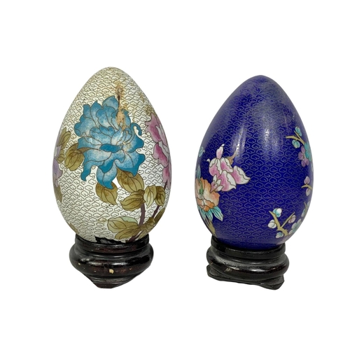 160 - 4 large cloisonné eggs on wooden bases. 20cm