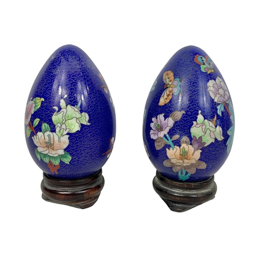 160 - 4 large cloisonné eggs on wooden bases. 20cm