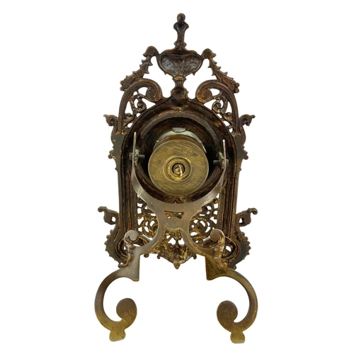 163 - A Victorian brass embossed mantle clock with silvered dial. 32cm.