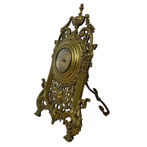 163 - A Victorian brass embossed mantle clock with silvered dial. 32cm.