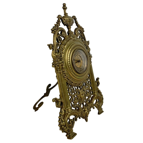 163 - A Victorian brass embossed mantle clock with silvered dial. 32cm.