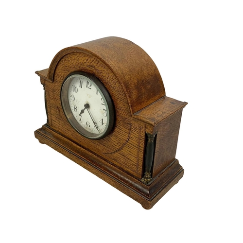 166 - An early 20th century inlaid oak mantle clock. Circa 1920. 24 x 19cm