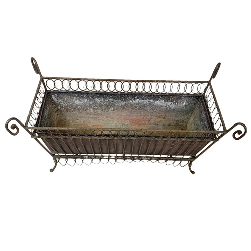 174 - A vintage French 19th century style wrought iron and wire planter. 55.5 x 26 x 29.5cm