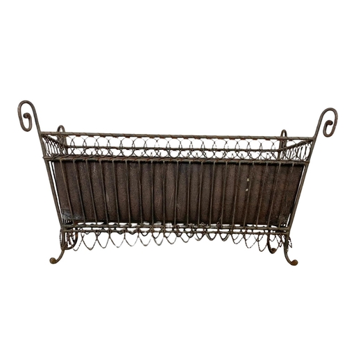 174 - A vintage French 19th century style wrought iron and wire planter. 55.5 x 26 x 29.5cm